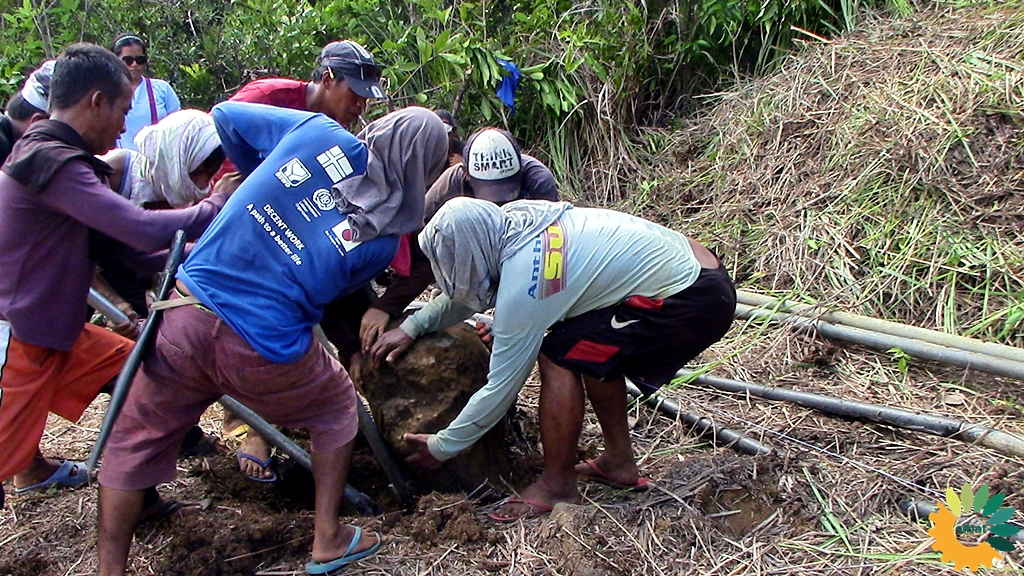 Pintakasi or Bayanihan system of the community.